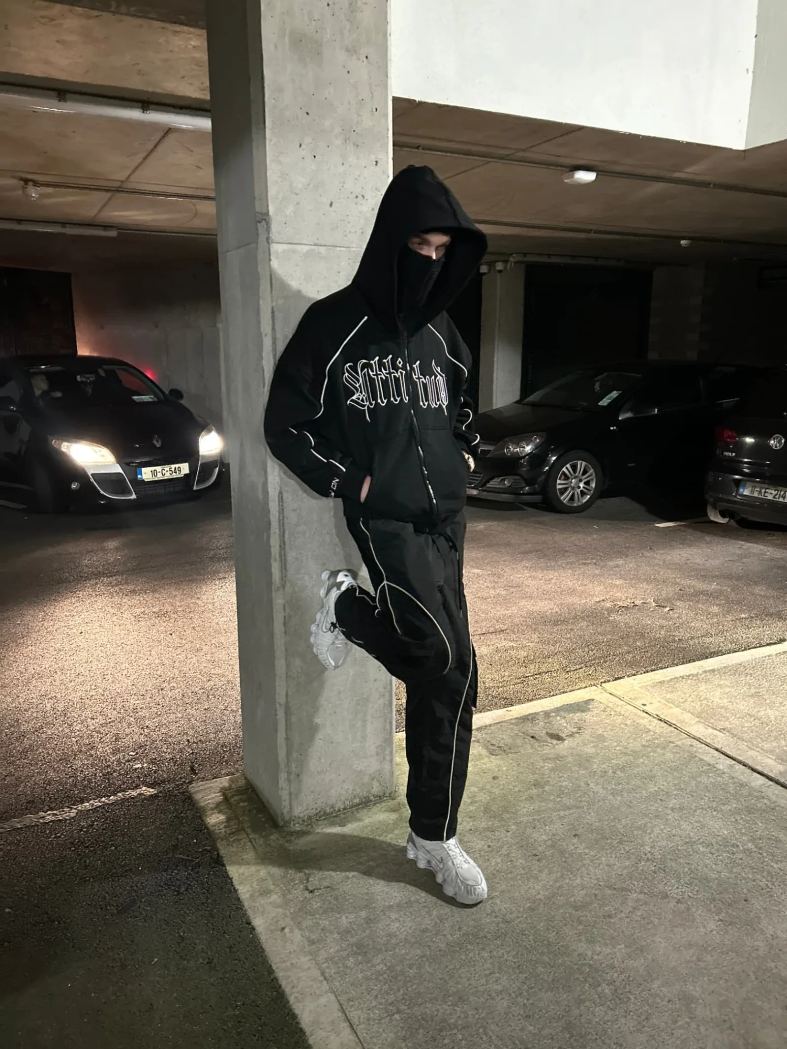 Finished PWA Clothing zip hoodie, balaclava and piped trousers worn on location at night